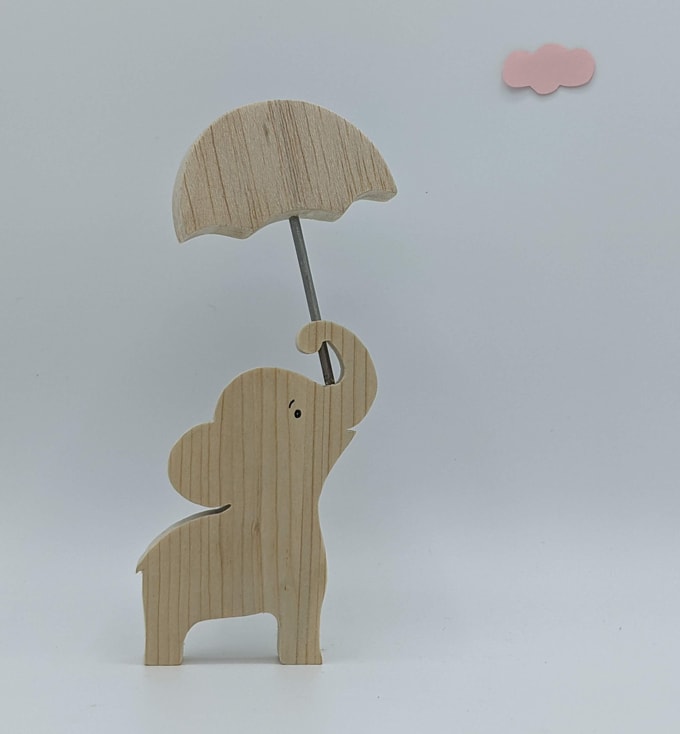 éléphant portant un parapluie